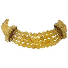 Vibrant crystal beaded choker composed of four strands of faceted round yellow crystals in front and two strands in back, separated by quarter-round spacers covered in two rows of the crystals. Adjustable link and stone closure in back. Marked "MADE ITALY' on reverse of each spacer. Although lacking their signature, it has all the hallmarks of the high quality pieces made by Coppola e Toppo. Yellow Crystals, Necklaces Choker, Crystal Stone Jewelry, Vintage Choker Necklace, Gold Link Necklace, Beautiful Chokers, Yellow Necklace, Yellow Jewelry, Vintage Choker