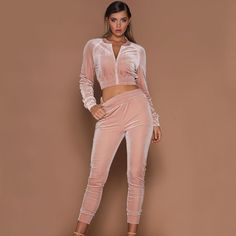 A little casual a lot of sexy... this jogger pant set has it all. Featuring a cropped zippered jacket with elastic trim and fitted jogger pants with an elastic waist in soft & comfy velvet finish. Made with a cotton blend and comes in three fabulous colors from which to choose. Crop Top Pants Set, Velvet Tracksuit, Velvet Joggers, Crop Top Sweatshirt, Tracksuit Set, Top Pants Set, Sport Chic, Tracksuit Women, Women Set