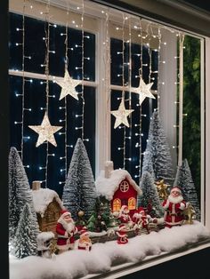 a window with christmas decorations and lights on it