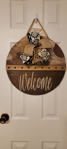 a welcome sign hanging on the front door