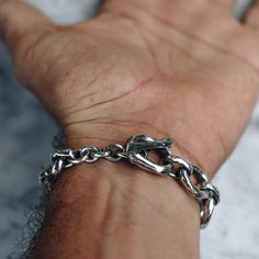 "925 Sterling silver Chunky Chain Bracelet with a toggle clasps. Available in women's and men's lengths. Makes a bold statement piece by itself or layer it for more style. Bracelet Length 15cm / 5.9\" inches 16cm / 6.3\" 17cm / 6.7\" 18cm / 7.09\" 19cm / 7.48\" Every piece is handcrafted in Bali and made with Intention, Love, and Soul so that it can be felt by it's wearer and ultimately change our energy and lives in a positive way. Each with it's own story of insight and love, our pieces, like Everyday Sterling Silver Bracelet With Chunky Chain, Silver Chain Bracelet With Stainless Steel Clasp For Everyday, Sterling Silver Bracelet With Chunky Chain For Everyday, Everyday Metal Chain Bracelet With Polished Finish, Sterling Silver Everyday Bracelet With Chunky Link Chain, Classic Silver Cuban Link Bracelet With Chunky Chain, Everyday Silver Chain Bracelet With Stainless Steel Clasp, Everyday Sterling Silver Chunky Link Bracelet, Everyday Polished Metal Chain Bracelet