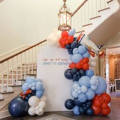 balloons and streamers decorate the entrance to an event