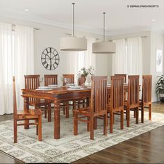 a dining room table and chairs with a clock on the wall in the back ground