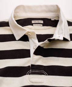 Rugby stripes lend a timeless, athletic appeal to this soft, cotton-jersey polo. Underarm embroidered grommets provide better ventilation and comfort, while the vintage-inspired interior ID label awaits your name or initials. 100% cotton jersey Garment-washed Natural color twill collar and placket Covered placket with rubber buttons Underarm embroidered grommets Signature flag tape on side seam Vintage inspired interior ID label Machine wash cold Imported White Cotton Polo Shirt With Striped Collar, White Collared Top With Signature Stripes, Classic Long Sleeve Polo Shirt With Contrast Stripes, Cotton Polo With Vertical Stripes, Classic Top With Polo Collar And Striped Cuffs, Cotton Polo Shirt With Striped Cuffs, Classic Tops With Polo Collar And Striped Cuffs, Cotton Polo Collar Top With Vertical Stripes, Classic Tops With Striped Cuffs And Polo Collar