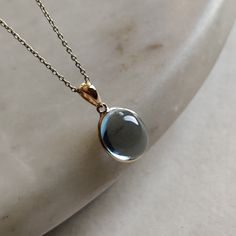 ITEM DESCRIPTION: >>The pendant is made from Solid 14K Yellow Gold. Gemstone used is absolutely natural and ethically sourced. >>Natural Sky Blue Topaz in cabachon and oval shape with bezel setting is studded on it with utmost precision. >>This is a minimalist design and is absolutely hassle-free and everyday jewelry. Gem: Sky Blue Toapz Gem size: 10x12 mm oval Gem weight: 7.68 carats Gold purity: 14K (58.33% approx.) Gold weight: 0.53 grams Gross weight: 2.07 grams The Gold purity is guaranteed Gold Skies, Handmade Jewelry Box, Blue Topaz Pendant, Topaz Pendant, Bezel Pendant, Sky Blue Topaz, December Birthstone, Unique Gemstones, Fantasy Jewelry