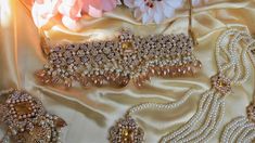 A must have for the upcoming wedding season! This bridal set is a unique blend of royal and modern with its pastel hues and gold plating. The set is gorgeous with pearls and is a full bridal piece but can be worn separately for a lighter and simple look. Set includes: mala , earrings, maang tikka , passa, choker In stock and ready to ship‰Û? Gold Bollywood Sets With Pearl Embroidery, Party Sets With Pearl Embroidery In Gold, Gold Sets With Pearl Embroidery For Reception, Elegant Gold Bridal Belt For Reception, Gold Party Sets With Pearl Embroidery, Elegant Gold Bridal Accessories For Festive Season, Elegant Tilla Wedding Sets, Elegant Wedding Sets With Tilla Details, Festive Gold Bridal Accessories