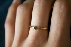 STUNNING 14k gold filled or Sterling Silver handmade Nephrite Jade ring ✨ * Listing covers the single Nephrite Jade ring. Beautiful 3mm olive green Jade gemstone✨⚒️ Jade is a special stone that is believed to promote wisdom, balance, and peace. Jade has a history that traces back to prehistoric times, to the ancient Chinese, the Maori, and to the Aztecs and Inca peoples of Central America. Reputed by folklore to attract love, this stone was also believed to deliver prosperity and power to those Minimalist Gold Emerald Stackable Ring, Everyday Green 14k Gold Stackable Rings, Dainty Green Jewelry With Simple Design, Minimalist Gold Emerald Ring For Everyday, Minimalist Gold Stackable Rings For May Birthstone, Minimalist Gold Stackable Rings With Emerald, Minimalist Gold Emerald Ring, Dainty 14k Gold Emerald Ring For Everyday, Minimalist Green Jewelry With Simple Design