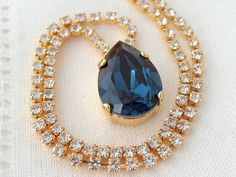 "Navy blue Swarovski rhinestone necklace, Bridal necklace, Bridesmaids gift, Rhinestones necklace, Pendant necklace, Silver or gold, dark blue THIS NECKLACE CAN BE CUSTOM MADE IN OTHER STONE COLORS AND PLATING. PLEASE CONTACT ME. Delictae an so refined. Beautiful navy blue SWAROVSKI crystal - so elegant and refined. This necklace will fit any outfit, day or night and would be a great bridal necklace as well as bridesmaid's gift. The chain is all made of tiny clear crystals soldered to a teardrop Sapphire Blue Earrings, Blue Bridal Earrings, Navy Blue Earrings, Swarovski Crystal Drop Earrings, Blush Earrings, Earrings Sapphire, White Opal Earrings, Bridal Earrings Chandelier, Blue Drop Earrings