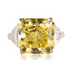 A magnificent fancy color diamond ring that features a GIA-certified 13.15 carat radiant cut Fancy Intense Yellow diamond, VS1 clarity. Flanking the center diamond are two sizable triangle-shaped diamonds. The yellow diamond is set in yellow gold prongs and the ring is platinum.

The GIA certificate states the center diamond weighs 13.15 carats, Fancy Intense Yellow, and VS1 clarity. Diamonds this size and color are very rare.

If you have any questions about the Fremont ring, please feel free to contact us.

 

https://youtu.be/aeZmPhfiMmQ Most Expensive Diamond Ring, Color Diamond Ring, Fancy Color Diamond Ring, Estate Diamond Jewelry, Gia Certificate, Expensive Jewelry, Radiant Cut, Fancy Color Diamonds, Girly Jewelry