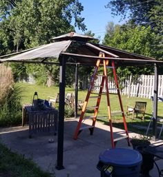 a wooden swing set sitting in the middle of a yard