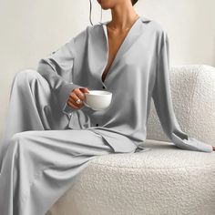 🌙 Luxe Satin Silk Pajama Set ✨ Elevate your comfort and sophistication with the Luxe Satin Silk Pajama Set! Made from premium satin silk, this oversized sleepwear set features a chic low-cut neckline and a single-breasted front. The long sleeves and wide-leg pants offer a relaxed fit, perfect for a stylish night in or a luxurious sleep experience. 🌟 #LuxeSatinSilk #PajamaSet #ChicSleepwear #RelaxedFit #ElegantComfort #LuxuryNightIn Elegant Loungewear, Two Piece Loungewear, Pyjama Satin, Pajama Fashion, Outfit Styling, Silk Pajama, Graduation Outfits, Silk Sleepwear, Green Tone