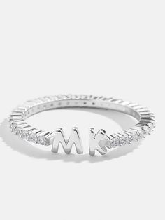 Our Sterling Silver Double Initial Custom Ring is an updated take on a classic initial accessory. Available in an all-gold and a subtle sparkly version, these rings are ones you'll have for years to come. Add your own initials or that of you and a loved one to create a keepsake you'll cherish. Not to mention, this ring is crafted with sterling silver and Cubic Zirconia stones. Classic White Gold Initial Ring With Cubic Zirconia, Formal Silver Initial Ring With Diamond Accents, Classic Silver Initial Ring With Diamond Accents, Classic Cubic Zirconia Initial Ring, Silver Monogram Diamond Rings, Silver Elegant Monogram Initial Ring, Silver Monogram Rings Fine Jewelry, Silver Monogram Rings In Fine Jewelry Style, Elegant Silver Monogram Initial Ring