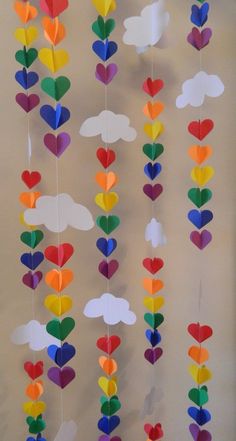 paper hearts and clouds hanging from the ceiling