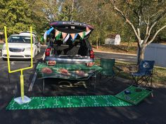 a football field is set up in the back of a van for tailgates