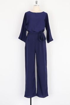 This long casual pants back keyhole jumpsuit makes it easy for you to look stylish and amazing. It is designed to match your fashion taste. Its natural waist middle design makes the dress hug your curves in all the right places. The dress’s high-quality fabric makes it flowing and comfortable on your skin. Its batwing sleeve fastens with a button at the back. Overall, this dress will elevate your style and improve your appearance. The Dress for All Seasons Exact Go-To Dress Giftable Outfit Super Elegant Stretch Jumpsuits And Rompers In Solid Color, Elegant Full-length Solid Jumpsuits And Rompers, Elegant Summer Full-length Jumpsuits And Rompers, Elegant Full Length Solid Color Jumpsuit, Chic Solid Color Overalls Jumpsuit, Summer Workwear Full-length Jumpsuits And Rompers, Spring Workwear Full-length Jumpsuits And Rompers, Chic Loungewear Jumpsuits And Rompers With Elastic Waistband, Chic Loungewear Jumpsuits With Elastic Waistband