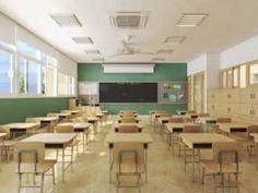 an empty classroom with wooden desks and green walls