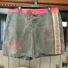 1980's vintage beach shorts/swim trunks but proper board shorts ( no elastic or liner). Original vintage ( you can tell by the length, inseam and the drawstring), Short Velcro fly and Velcro back pocket. Current Men's 36 ( 18.5" each side, for a total of 37" around). Used, with no flaws. Billabong brand. Ignore red spots- they are from camera flash. Materials tag is unreadable, probably 100% Cotton. Men's current 36 ( will only fit 35,36" waists) : laid flat, they are 18.5" each side, so a total Vintage Surf Board, Vintage Surf Wear, 2000s Boys, 70s Shorts, Men 90s, Surf Shorts, Vintage Surf, Surf Board, Surf Wear