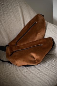 Brown Velvet Belt Bag This Brown Velvet Belt Bag is perfect choice if you are keen on bikes, festivals and traveling when you want to be sure that your valuables are safe and within hand's reach. This small bum bag is very practical for everyday use. It is suitable and safe for phone, wallet, headphones, keys, cosmetics and yet stylish at the same time.  All Ira Bags are made by hand in our studio in Belgrade. The bag is made of soft and light velour. Bag is not waterproof but rather water-repel Functional Brown Bag With Zipper Pouch, Velour Bag, Hands Free Bag, Velvet Belt, Cell Phone Bag, New Cosmetics, Bag Elegant, Brown Velvet, Bum Bag