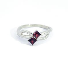 0.14 ct Princess Cut Garnet Two Stone Ring in 10K Gold Two princess cut Almandine Garnet (3.3mm x 3.3mm) in 4 prong setting 1.75mm 10K Yellow Gold novelty band Engraved with the affirmation "MM Luvs U" Charged in signature crystal grid and infused with Reiki for generational blessings (click for custom crystal grid charging and intuitively focused Reiki ) Handmade in Los Angeles using domestically sourced gold and Mozambique Garnet. This ring is size 7.0 but will be resized to fit you! Please sp Princess Cut Birthstone Rings For Formal Occasions, Formal Square Cut Birthstone Ring In Fine Jewelry Style, Square Cut Birthstone Ring For Formal Events, Square Cut Birthstone Ring For Formal Occasions, Fine Jewelry Square Cut Birthstone Ring For Formal Occasions, Formal Square Cut Birthstone Ring, Classic Rings With Garnet And Prong Setting, Classic Garnet Rings With Prong Setting, Princess Cut Solitaire Birthstone Ring For Formal Occasions