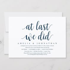 an elegant wedding save the date card with black ink on white paper, which reads at last we did