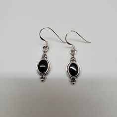 Hello, Welcome to our shop Q925jewelry.etsy.com and hope you enjoy shopping here! *sterling silver earrings *hook earrings *black onyx / black stone *size and shape of stone in mm: 9x7 oval *color: black *materials: made from sterling silver .925 *southwestern designs *simple **size of a penny in picture: 19mm **size of a quarter dollar: 24.25mm **please compare our jewelry items with those coins for getting some ideas with the sizes of individual parts or jewelry item **all of our jewelry are m Hematite Jewelry, Black Onyx Jewelry, Black Earrings Dangle, Onyx Jewelry, Southwestern Jewelry, Sterling Silver Dangle Earrings, Silver Jewelry Handmade, Black Earrings, Silver Earrings Dangle