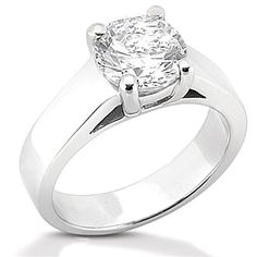 a white gold ring with a diamond in the center