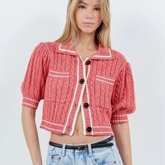 Elevate your casual look with our Cardigan Tee, a cropped knit tee in a trendy reddish-pink hue. Perfect for those preppy yet laid-back spring and summer days. Material & Care: Crafted from 60% cotton and 40% acrylic. Hand wash in cold water with mild detergent. Avoid wringing or twisting. Lay flat to dry away from direct sunlight. If needed, use a cool iron. Size & Fit: Model is 5'9 wearing size small Trendy Cropped Summer Cardigan, Trendy Cropped Cotton Cardigan, Preppy Knit Tops For Spring, Spring Preppy Cotton Sweater, Preppy Spring Knit Tops, Spring Preppy Knit Tops, Preppy Pink Tops For Fall, Trendy Knit Cropped Sweater For Summer, Casual Cropped Cotton Cardigan