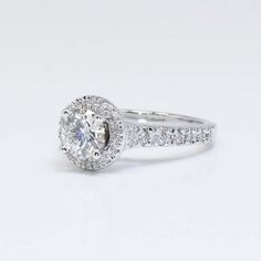 a diamond engagement ring on a white background