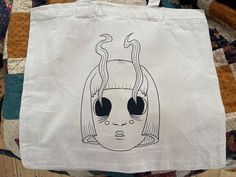 Canvas tote bag with hand drawn design in the front.  Tote is 15inx17in with long handle  Black vinyl on beige tote bag White Screen Print Bags For Everyday Use, White Screen Printed Bag As Gift, White Screen Print Bag As Gift, Rectangular Screen Print Bag For Everyday Use, Rectangular Bags With Screen Print For Daily Use, Gothic Tote Shoulder Bag For Everyday Use, Gothic Tote Bag For Everyday Use, Ghost Tote Bag, Beige Tote Bag