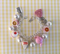 Alice in Wonderland Bracelet - Pink Tea Party Bracelet - Heart Locket Charm Bracelet - Fairy Tale Bracelet - Fairy Tale Jewelry - Fantasy Bracelet - Gift for Her - Valentine Gift - Birthday Gift Lovely Alice in Wonderland Bracelet full of tea party charms inspired by Alice in Wonderland story. Some charms are handmade out of polymer clay , some are in glass ,plastic  or metal  . A lovely  heart charm locket is added to this bracelet , you can open it an insert a tiny message or picture or whatev Handmade White Charm Bracelet For Party, Sweet White Bracelet Jewelry, Cute Handmade Charm Bracelet For Party, Cute Silver Charm Bracelet For Party, Handmade Bracelets For Valentine's Day Party, Adjustable Sweet Jewelry For Party, Party Jubilee Charm Bracelet, Whimsical Pink Charm Bracelet For Birthday, Tea Party Jewelry