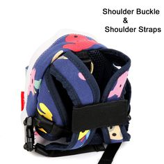 the shoulder and shoulder strap straps are attached to a small backpack with colorful flowers on it