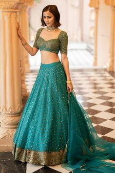 Teal green lehenga with an attached cancan and nakshi and sequins embroidery. Comes with a padded blouse and a dupatta. Components: 3 Pattern: Embroidered Type Of Work: Nakshi, Sequins Neckline: Sweetheart Sleeve Type: Short Fabric: Organza, Semi crepe, Lining: Semi crepe Color: Green Other Details:  Attached lining Product Weight: 2 Kg Model Height: 5ft 9inches, wearing size S Closure: Lehenga: Side zip Blouse: Back hooks Note: Jewellery worn by the model is not for sale. Occasion: Wedding,Brid Green Organza Lehenga, Organza Lehenga, Organza Blouse, Green Lehenga, Padded Blouse, Sequin Blouse, Indian Wedding Wear, Organza Dupatta, Sequins Embroidery