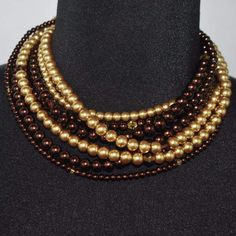 Brown and gold multi strand glass two toned pearls necklace. This is a six strands gray glass pearls that inter twined. Beautiful stacked glass pearls beaded necklace with crystal highlights. A beautiful and chic style for the fall and everyday wear. {"@context":"https://schema.org/","@type":"Product","name":"Multi Strand Brown/ Gold Two Toned Glass Pearls Necklace","image":"https://cdn.shopify.com/s/files/1/1069/4906/products/multi-strand-brown-gold-two-toned-glass-pearls-necklace-jewelry-stran Brown Pearl Necklace, Pearl Jewelry Necklace, Pearls Necklace, Grey Glass, Multi Strand, Necklace Jewelry, Brown Gold, Pearl Beads, The Fall