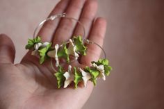 Discover Exquisite Handcrafted Floral Jewelry Delicate hoop earrings for a stylish look. Composition consists of stephanotises. Warning: no exposure to water.  Every flower is handcrafted from self hardening, lightweight,polymer clay, decoclay. 🌻 Jewelry for Every Occasion: Whether it's a special celebration, wedding, or simply adding a touch of nature to your everyday look, our floral earrings and rings are the perfect choice. They make memorable gifts for loved ones too. Green Flower Hoop Earrings For Gift, Green Flower Earrings For Gifts, Unique Green Hoop Earrings, Green Flower-shaped Nature-inspired Earrings, Nature-inspired Green Flower Earrings, Handmade Green Flower Hoop Earrings, Green Flower Earrings, Jewelry Delicate, Floral Jewelry