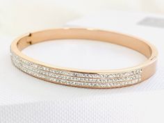 Rose gold bracelet / bangle for Bridesmaid and Maid of honour gift.  Bridesmaid and Maid of honour jewellery. Stunning love bangle encrusted with 3 sparkling rows of cubic zirconia rhinestones. Available in silver, gold and rose gold. Beautifully packaged in tissue wrap and a luxury white gift box. Gold Bracelet Bangle, Rose Gold Bangle Bracelet, Gold Arm Band, Love Bangle, Gift For Bridesmaids, Maid Of Honour, Gold Armband, Maid Of Honour Gifts, Rose Gold Bracelet