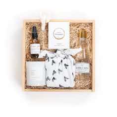 an open gift box containing the contents of a skin care product