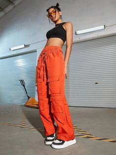 Make a bold fashion statement with these Orange Waist Flap Pocket Cargo Pants. Their plain pattern and high waistline add a touch of sophistication to your casual look. The drawstring waist ensures a comfortable fit, while the non-stretch fabric offers durability. These long-length pants are ideal for any occasion, and the waist flap pockets add a trendy twist. Details: Color: Orange Style: Casual Pattern Type: Plain Type: Cargo Pants Closure Type: Drawstring Waist Waist Line: High Waist Length: Sporty High Waist Pants With Drawstring, Sporty Orange Bottoms With Drawstring, Sporty High Waist Drawstring Pants, Sporty High-waist Drawstring Pants, Urban Style Summer Cargo Pants With Elastic Waistband, Trendy High Waist Sweatpants With Drawstring, Trendy High Waist Drawstring Sweatpants, Trendy High Waist Parachute Pants With Elastic Waistband, Trendy Non-stretch Parachute Pants With Cargo Pockets