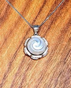 "Lovely Light Silver Hand carved Genuine Freshwater Swirl Carved 11.1mm Pearl, 3/4\" Sterling Silver CZ pendant (chain not included)  Looks like Moonlight, Shimmering luster captured in a Circle of Sparkling CZs. Awesome gift! Chains are available in the chain section of our store. Will be Gift Boxed for easy gift giving." Wedding Ready, Cz Pendant, Easy Gifts, Sterling Silver Pendant, Sterling Silver Pendants, Fresh Water, Silver Pendant, Freshwater Pearls, Swirl