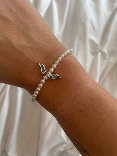 Handmade beaded bracelet with Czech glass pearlised beads and silver angel Wings charm  Stretch chord Angel Wing Bracelet, Angel Bracelet, Silver Angel Wings, Memorial Bracelet, Protection Bracelet, Bracelets Handmade Beaded, Healing Bracelets, Guardian Angel, Angel Wings