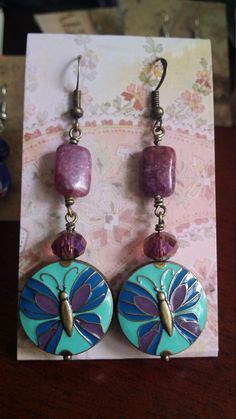 Enameled Brass Butterfly beads with sugilite and purple crystals. ALL LISTINGS PRICED AT $15 IN THE 3 FOR $25 GROUP ARE NOW ON SALE!  The following discount applies ONLY to earrings from this group and can ONLY be applied to groups of 3!  Enter MEGASALE45 at checkout to receive your discount!  I craft original, to order, and customizations on weekends, and ship Tuesday.  Orders placed for in stock, as-is items ship within 3 business days or faster.  If you need a piece in a hurry, please shoot me a note and let me know so that I can do my best to accommodate you! Handcrafted with love in the beautiful Pacific Northwest. I craft original, to order, and customizations on weekends, and ship Tuesday.  Orders placed for in stock, as-is items ship within 3 business days or faster.  If you need a Purple Czech Glass Earrings For Gift, Nickel-free Purple Czech Glass Jewelry, Hypoallergenic Purple Bohemian Earrings, Purple Czech Glass Dangle Jewelry, Purple Czech Glass Jewelry With Matching Earrings, Nickel-free Purple Enamel Jewelry, Purple Vintage Jewelry, Mismatched Jewelry, Purple Crystals