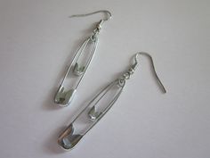 This Earring Pair is made of Recycle Safety Pins, Carefully crafted to give it a unique look, They are sure to add a dash of style to every outfit. Worn a true fashion statement and a Definite must have, Lightweight dangle earrings, rubber stoppers included. Unique piece, Please contact me with any questions. One of a Kind, handmade by the ChaidezBoutique I appreciate your business and thank you for visiting my shop! shop additional styles available in my shop: Punk Safety Pins, Pin Earrings, Safety Pin Earrings, Safety Pins, Safety Pin, Earring Gifts, Bracelet Making, Fashion Statement, Favorite Jewelry