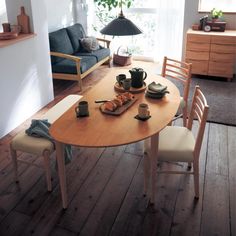 a dining table and chairs in a room