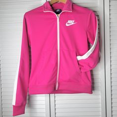 In Perfect Condition- Never Worn Hit Pink In Color With White Accents Full Zip Closure Two Hand Pockets Polyester Bust- 18 Inches Across Length- 23 Inches Women's Size X-Small Bundle & Save - Shipped Within 24 Hours White Nike Hoodie, Nike Pullover Hoodie, Running Hoodie, Tops Nike, Nike Fit, Athletic Sweatshirts, Nike Pullover, White Halter Maxi Dress, Nike Sweatshirts