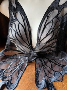 a woman's bra with butterfly wings on it