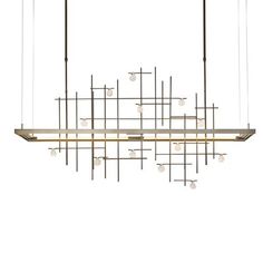 a modern chandelier with multiple lights hanging from it's long metal rods