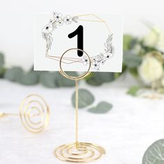 there is a table card holder with a number on it