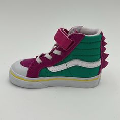 New Vans Kids Purple & Green Dino Sk8-Hi Reissue 138 V Little Kids Sneakers New With Tag / Without Box High-Top Paneled Suede And Canvas Sneakers In Purple And Green. Graphic Appliqus At Vamp And Heel. Round Rubber Cap Toe Elasticized Lace-Up And Velcro Closure Padded Tongue And Collar Treaded Rubber Outsole In Tan Supplier Color: Dino Fuchsia Red/Pepper Green Vans Us Size: Child's Foot Length 10.5: 6.125 / 15.6 Cm 11: 6.25 / 15.9 Cm 11.5: 6.375 / 16.2 Cm 12: 6.625 / 16.8 Cm 12.5: 6.75 / 17.1 Cm 13: 6.875 / 17.5 Cm 1: 7.25 / 18.4 Cm 1.5: 7.375 / 18.7 Cm 2: 7.5 / 19.1 Cm 2.5: 7.625 / 19.4 Cm 3: 7.875 / 20 Cm Upper: Leather, Textile. Sole: Rubber Purple Vans Lace-up Skate Shoes, Playful Green Sneakers With Rubber Sole, Purple Vans High-top Sneakers, High-top Non-slip Skate Shoes For School, Sporty Purple Vans Skate Shoes, Purple Vans Sneakers With Rubber Sole, Sporty Purple Vans Sneakers, Purple Low-top Vans Sneakers, Casual Purple Non-slip Sneakers