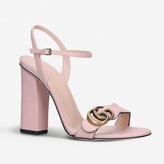 The Gucci GG Marmont Block Heel Sandal in Perfect Pink is crafted from a smooth calfskin leather in Italy. These high heeled sandals feature a curved, wavy toe strap with a Marmont GG logo, branded insole, adjustable ankle strap, an open toe, almond shaped toe, and 4" block heel. Perfect Pink Gucci GG Marmont Block Heel Sandal Antique gold-tone hardware High heel sandal shoes Curved toe strap GG logo plaque Adjustable ankle strap Open toe Almond shaped toe 4" block heel Size 39, 39.5 Product num High Heeled Sandals, Gucci Heels, Classy Shoes, Sandal Shoes, Gucci Gg Marmont, Almond Shaped, Gg Logo, Gg Marmont, Perfect Pink