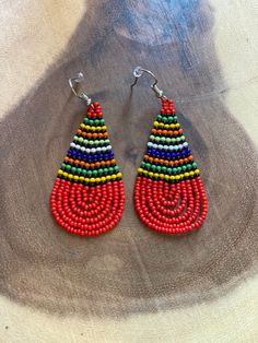 These handmade beaded earrings are truly unique. Each one is hand made with a rotating striped pattern. These earrings are available in a multitude of colors -making them perfect for any outfit! Whether it's dressing up a jean jacket or adding a unique texture to a LBD, there's no way you can go wrong with these earrings! We have given each design a name in honor of our favorite people! Please note that colors may vary a bit by pair as no two are exactly alike Handmade Beaded Earrings, Handmade Earrings Beaded, Beaded Earrings Patterns, Zulu, Earring Patterns, Bead Designs, Diy Jewelry Making, Bead Crafts, No Way