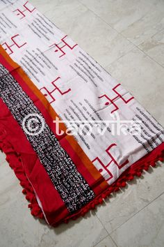 Presenting a range of light, breezy, and soft mul cotton Sarees which are perfect for the summers! This 'spiritual' themed hand block printed saree is made on pure mul cotton in white featuring texts and the spiritual symbols. The soul of this saree lies in its comfort and ease of carrying. You can style this with crop tops or blouses, a messy bun, junk jewelry and mojris or flats! The print might have slight irregularities in the pattern & colors which results from the human involvement in Festive Cotton Dupatta With Block Print, Festive Cotton Block Print Dupatta, White Cotton Dupatta With Block Print, Cotton Dupatta With Printed Border, Multicolor Cotton Dupatta For Navratri, Summer Chanderi Dupatta With Block Print, Summer Chanderi Dupatta With Printed Border, Cotton Saree With Bandhani Print For Navratri, White Cotton Dupatta For Navratri